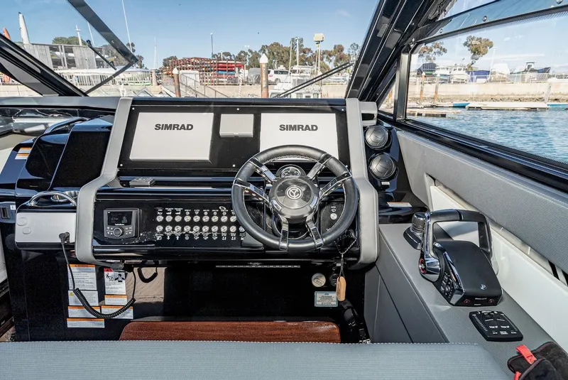 Slide: The Image of 2023 Cruisers Yachts 42 GLS cockpit with Simrad displays. - 28