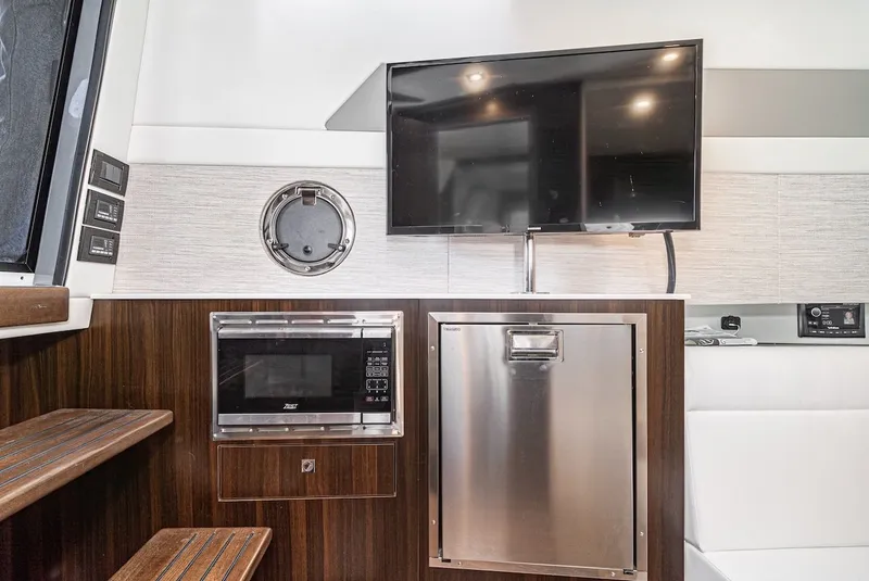 Slide: The Image of Interior of 2023 Cruisers Yachts 42 GLS with TV and microwave. - 35