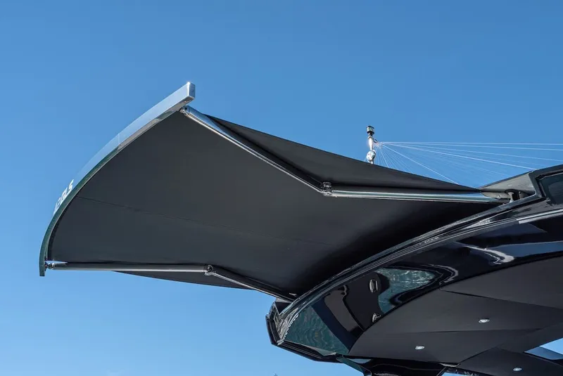 Slide: The Image of Sunshade on Cruisers Yachts 42 GLS 2023 against blue sky. - 9