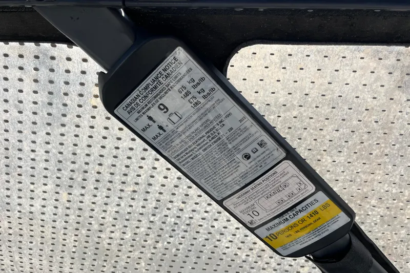 Slide: The Image of 2023 Sea-Doo Switch Cruise 21 compliance label showing capacity and safety information. - 13