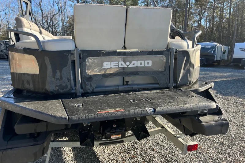 Slide: The Image of 2023 Sea-Doo Switch Cruise 21 rear view in outdoor setting. - 6