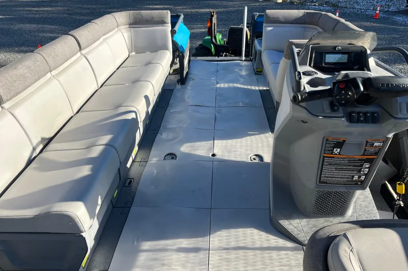 Slide: The Image of 2023 Sea-Doo Switch Cruise 21 interior with spacious seating and modern dashboard. - 9