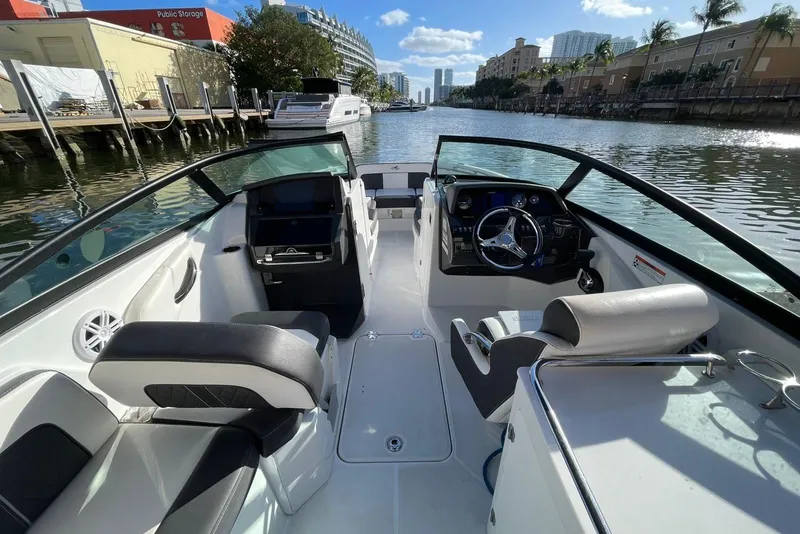 Slide: The Image of Interior view of a 2022 Monterey M-65 boat, featuring sleek seating and modern controls. - 7