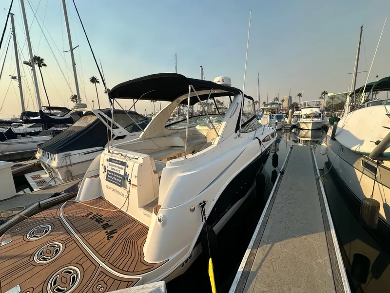 Slide: The Image of 2012 Bayliner 335 Cruiser docked at marina. - 11