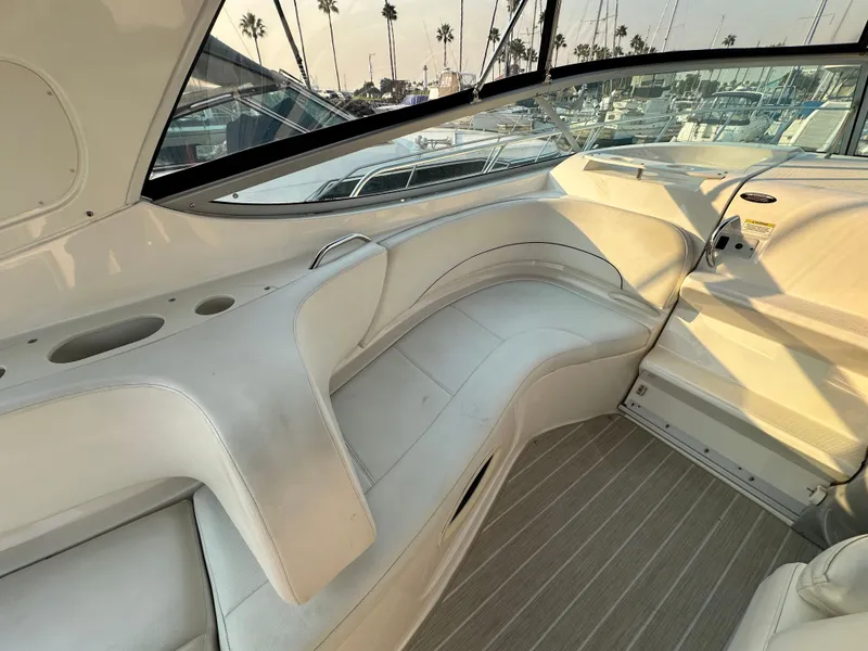 Slide: The Image of Interior of a 2012 Bayliner 335 Cruiser with white seating. - 15