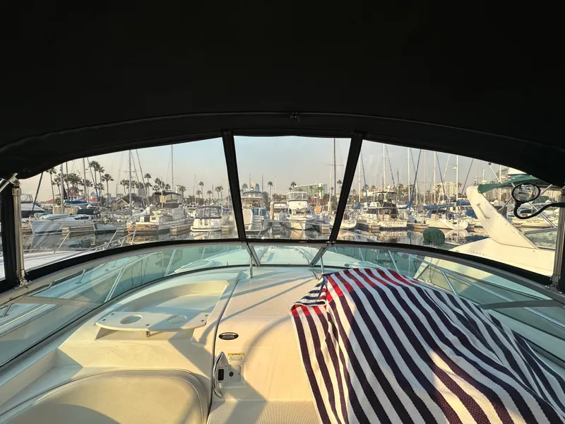 Slide: The Image of Interior view of a 2012 Bayliner 335 Cruiser in the marina. - 16