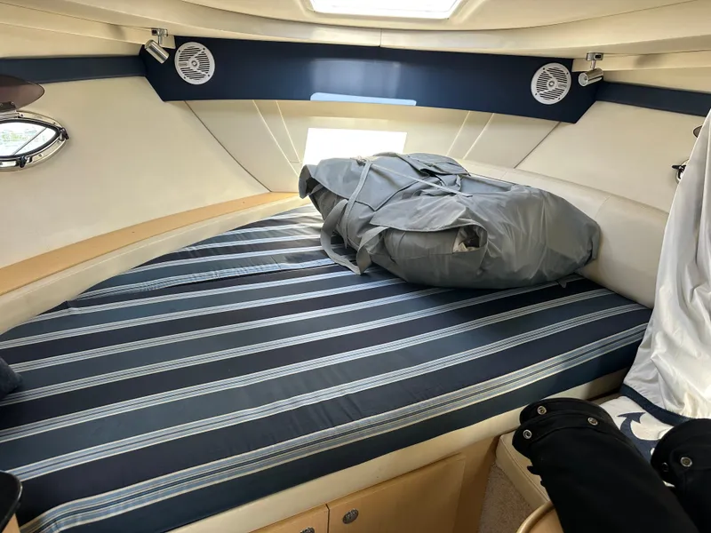 Slide: The Image of Interior of 2012 Bayliner 335 Cruiser with striped bed. - 19