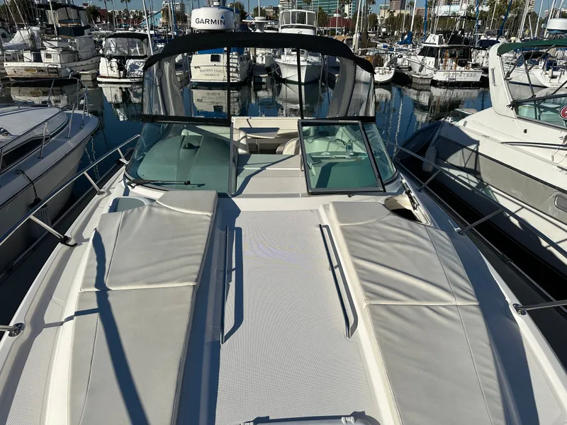 Slide: The Image of 2012 Bayliner 335 Cruiser in marina, front deck view. - 2