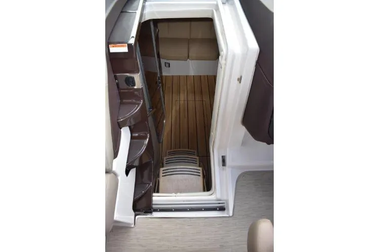 Slide: The Image of Interior view of 2015 Regal 32 Express boat cabin with wooden flooring. - 12