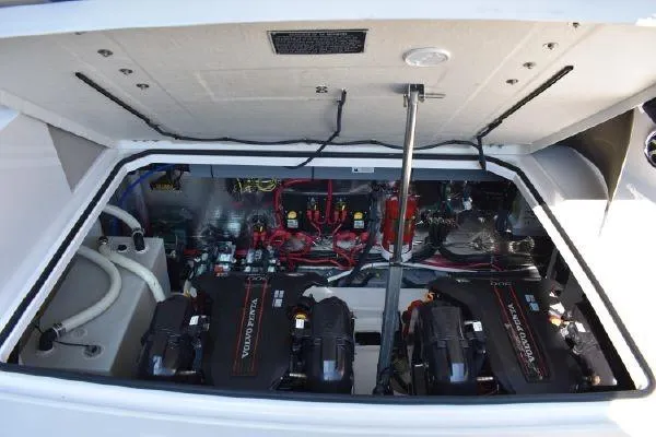 Slide: The Image of Engine compartment of 2015 Regal 32 Express boat, showcasing dual Volvo Penta engines. - 21