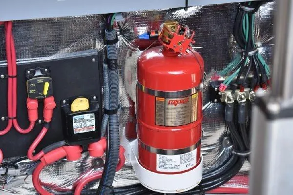 Slide: The Image of Engine compartment of 2015 Regal 32 Express with fire extinguisher and wiring. - 24