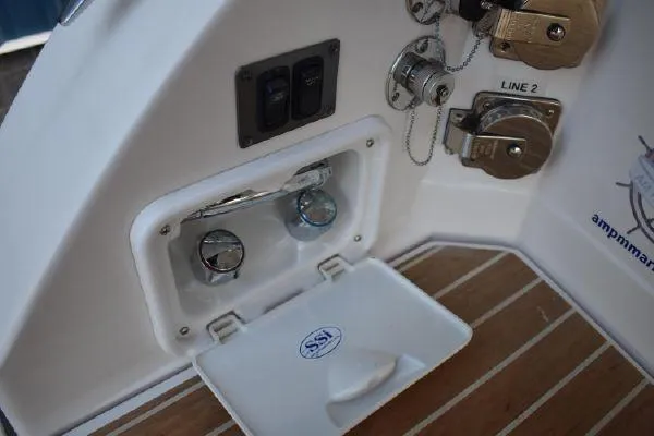 Slide: The Image of 2015 Regal 32 Express boat deck controls and fittings. - 25