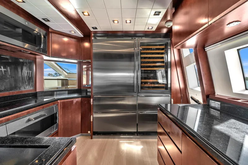 Slide: The Image of Luxurious kitchen interior on 2010 Azimut 95 yacht with modern appliances and sleek design. - 13