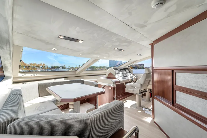 Slide: The Image of Luxurious interior of 2010 Azimut 95 yacht with modern helm and seating area. - 14