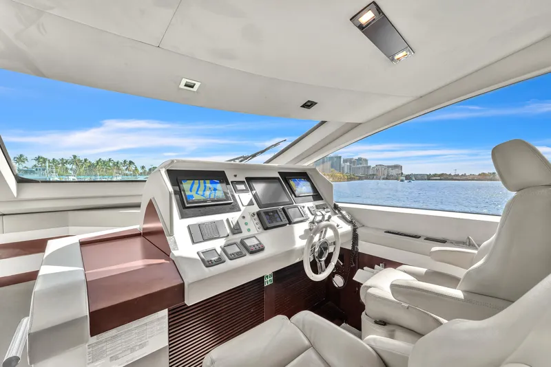Slide: The Image of Luxurious helm of 2010 Azimut 95 yacht with modern navigation systems and waterfront view. - 15