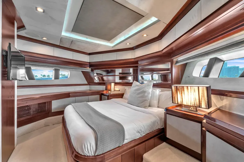 Slide: The Image of Luxurious bedroom interior of 2010 Azimut 95 yacht with elegant wood finishes and modern lighting. - 20