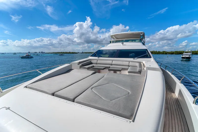Slide: The Image of Luxurious 2010 Azimut 95 yacht with spacious sun deck, cruising on a clear blue sea. - 24