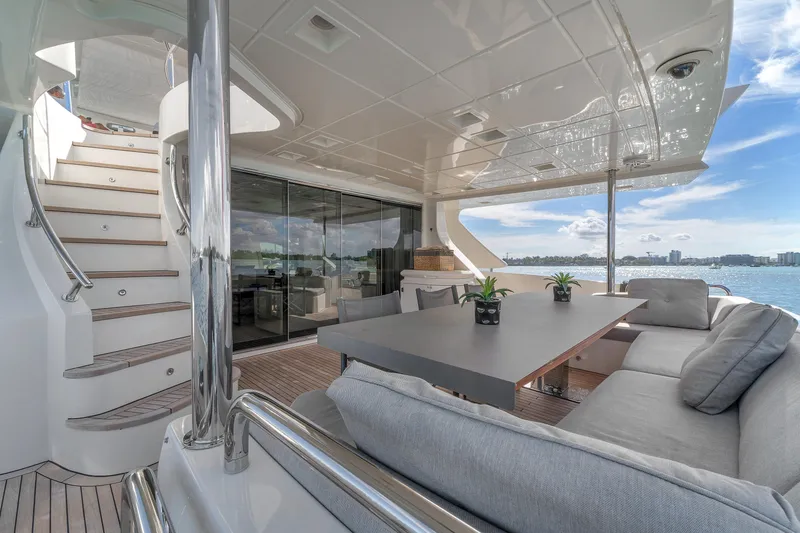 Slide: The Image of Luxurious 2010 Azimut 95 yacht deck with modern seating and ocean view. - 28