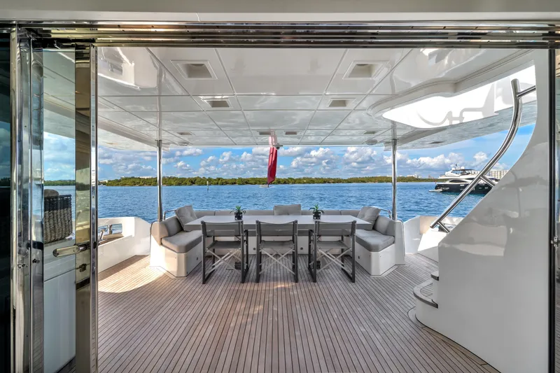 Slide: The Image of Luxurious 2010 Azimut 95 yacht deck with elegant seating and scenic ocean view. - 5