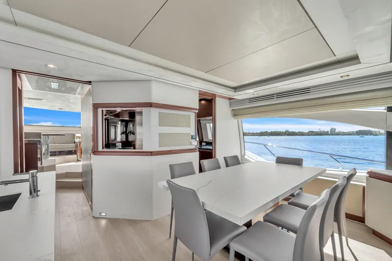 Slide: The Image of Luxurious interior of 2010 Azimut 95 yacht with elegant dining area and scenic ocean view. - 6