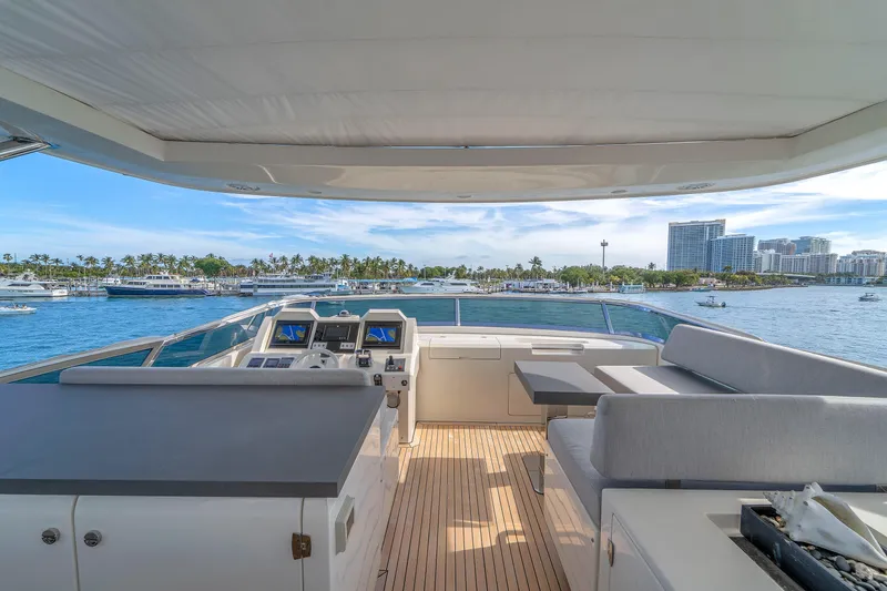 Slide: The Image of Luxurious 2010 Azimut 95 yacht deck with scenic waterfront view and modern seating area. - 9