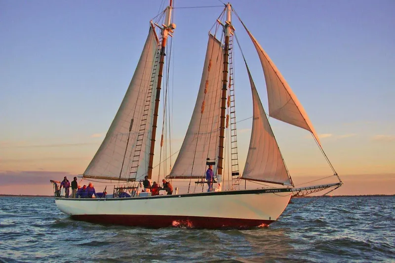 The Image of Sailing on a Treworgy 65 Schooner, 1992 model, at sunset on open water. - 0