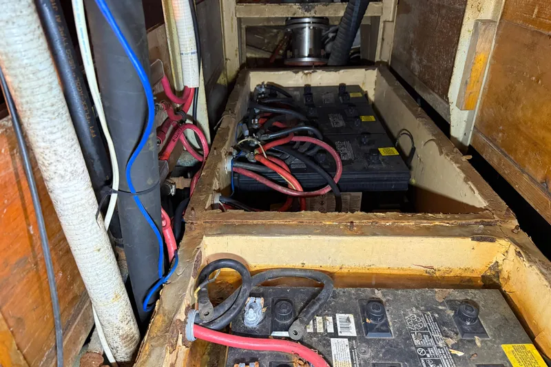 Slide: The Image of Battery compartment of a 1992 Treworgy 65 Schooner with visible wiring and connections. - 31