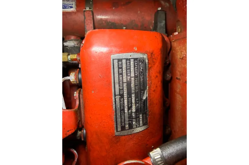 Slide: The Image of Red engine component with Ford Industrial Power Products label, Treworgy 65 Schooner 1992. - 32