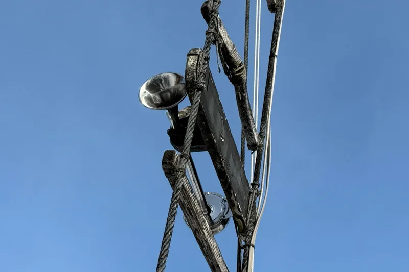 Slide: The Image of Mast rigging of 1992 Treworgy 65 Schooner against clear blue sky. - 5