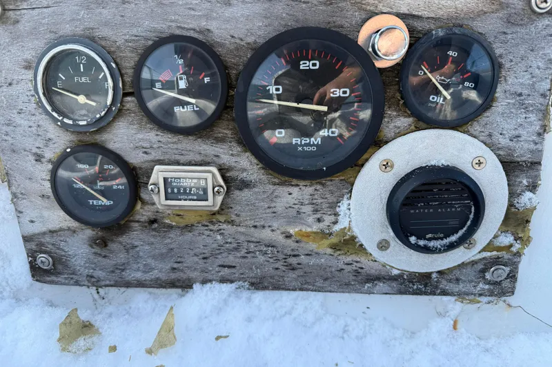 Slide: The Image of Weathered dashboard of 1992 Treworgy 65 Schooner with gauges and water alarm. - 7