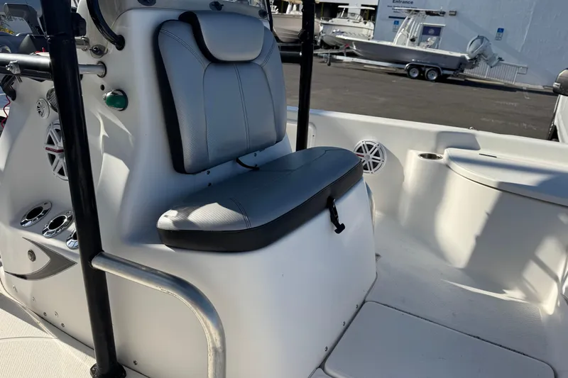 Slide: The Image of 2016 Blue Wave 2200 boat interior with seating and control panel. - 13