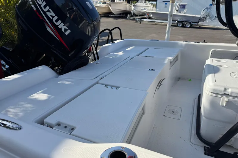 Slide: The Image of 2016 Blue Wave 2200 boat interior with Suzuki outboard motor. - 15