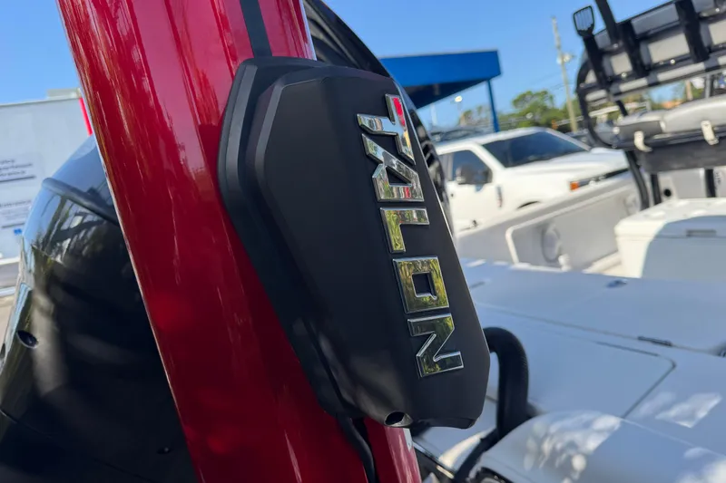 Slide: The Image of Red Talon anchor on 2016 Blue Wave 2200 boat, parked with vehicles in background. - 19