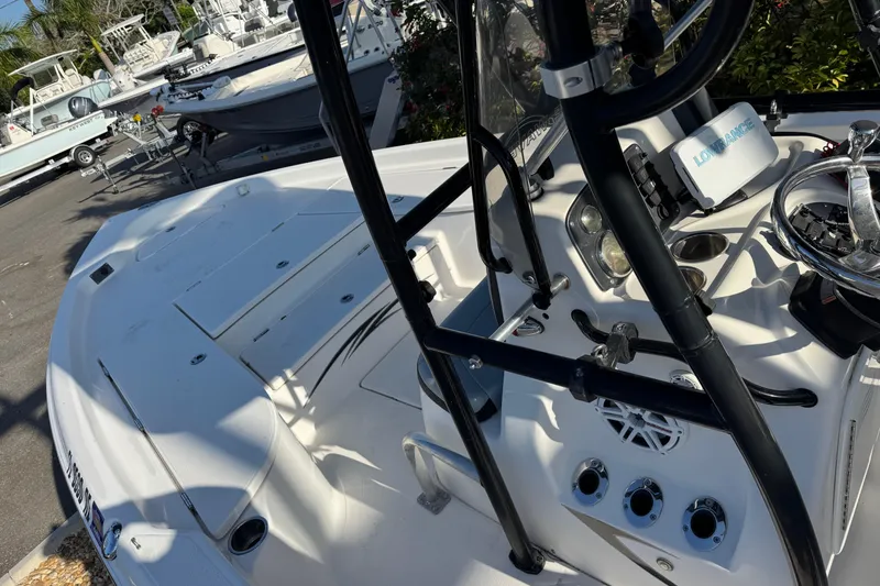 Slide: The Image of 2016 Blue Wave 2200 boat interior with steering wheel and control panel. - 30