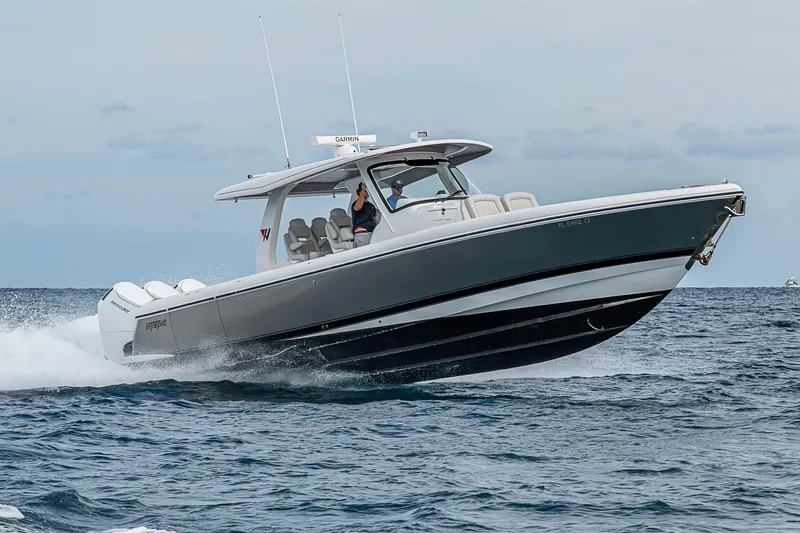 The Image of 2023 Intrepid 427 Nomad SE cruising on open water, showcasing sleek design and performance. - 0