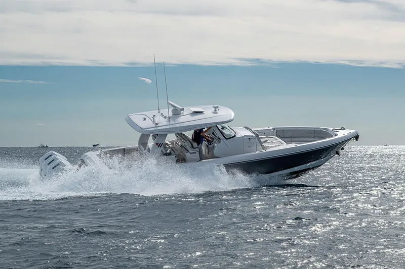 Slide: The Image of 2023 Intrepid 427 Nomad SE cruising on open water, showcasing sleek design and powerful performance. - 102