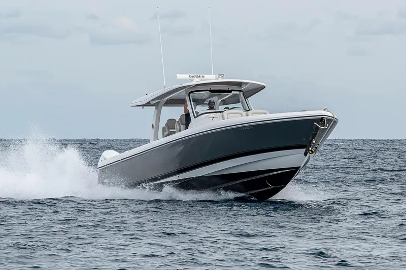 Slide: The Image of 2023 Intrepid 427 Nomad SE cruising on open water, showcasing sleek design and performance. - 107