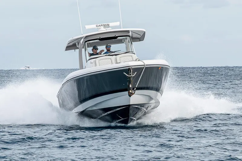 Slide: The Image of 2023 Intrepid 427 Nomad SE cruising on open water, showcasing sleek design and performance. - 109