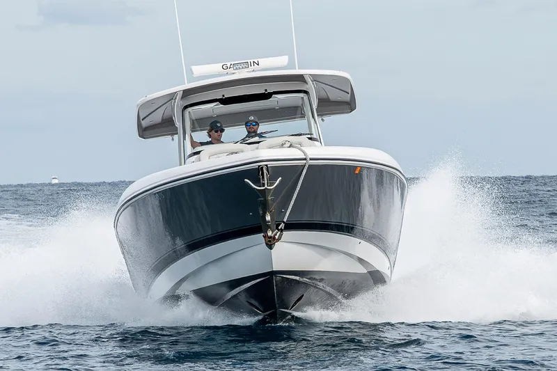 Slide: The Image of 2023 Intrepid 427 Nomad SE cruising on open water, showcasing sleek design and performance. - 110