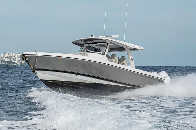 Slide: The Image of 2023 Intrepid 427 Nomad SE boat cruising on open water, showcasing sleek design and performance. - 113