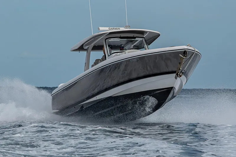 Slide: The Image of 2023 Intrepid 427 Nomad SE boat navigating through ocean waves. - 120