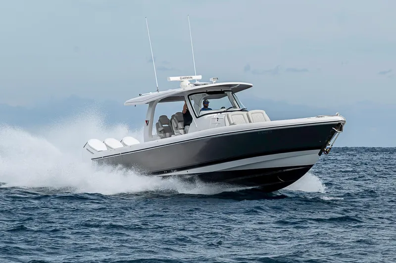 Slide: The Image of 2023 Intrepid 427 Nomad SE cruising on open water, showcasing sleek design and performance. - 121