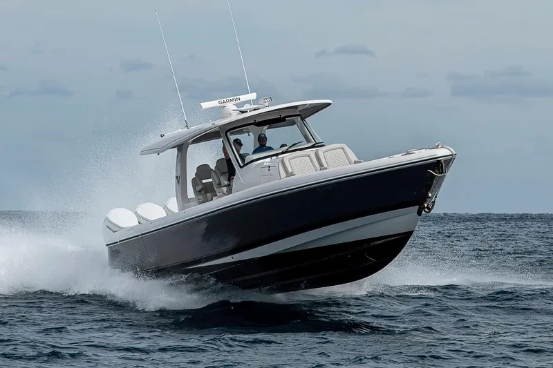 Slide: The Image of 2023 Intrepid 427 Nomad SE boat cruising on open water. - 123