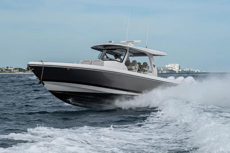 Slide: The Image of 2023 Intrepid 427 Nomad SE cruising on open water, showcasing sleek design and performance. - 127