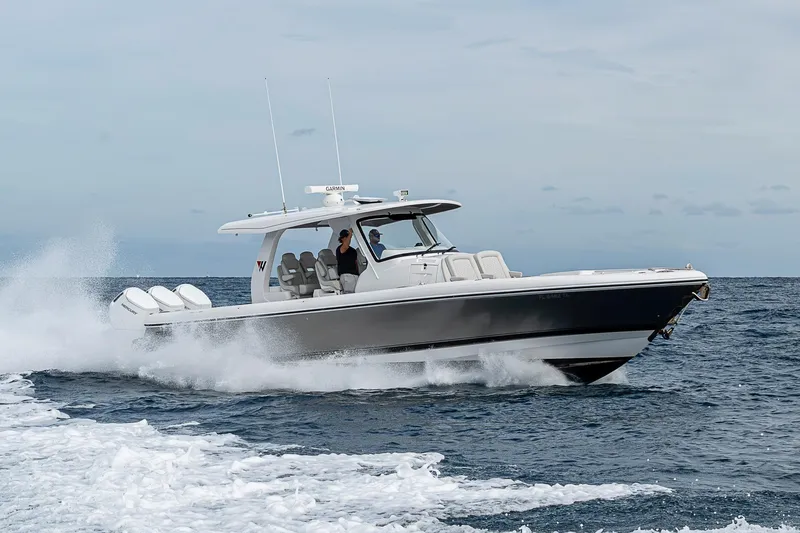 Slide: The Image of 2023 Intrepid 427 Nomad SE cruising on open water, showcasing sleek design and powerful engines. - 131