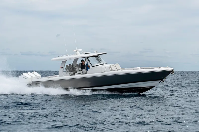 Slide: The Image of 2023 Intrepid 427 Nomad SE cruising on open water, showcasing sleek design and powerful engines. - 132