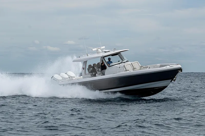 Slide: The Image of 2023 Intrepid 427 Nomad SE cruising on open water, showcasing sleek design and performance. - 134