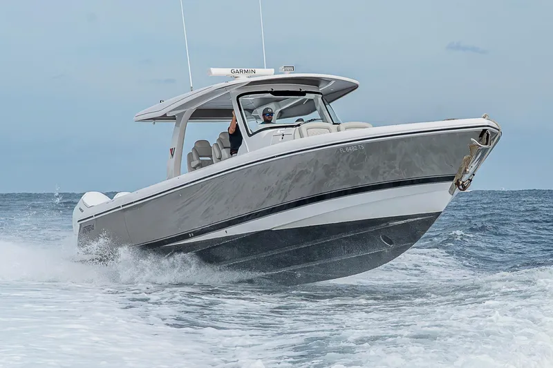 Slide: The Image of 2023 Intrepid 427 Nomad SE cruising on open water, showcasing sleek design and performance. - 141
