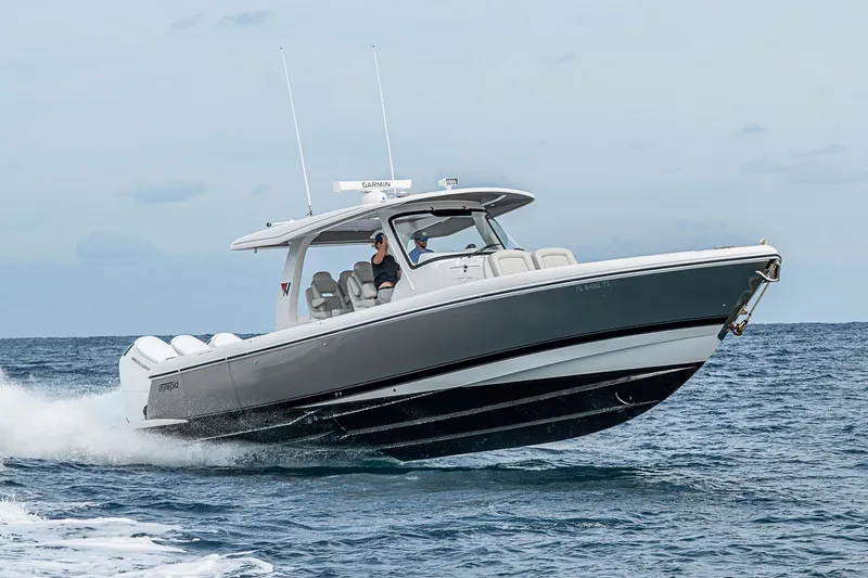 Slide: The Image of 2023 Intrepid 427 Nomad SE boat cruising on open water. - 142