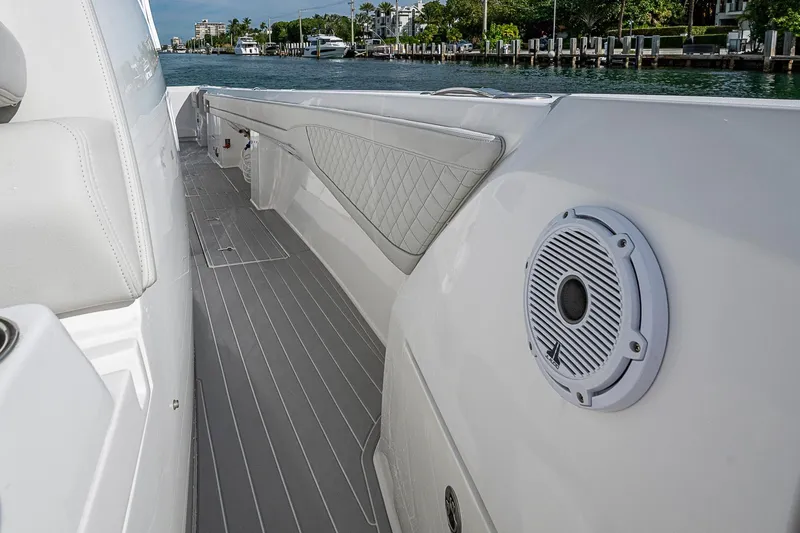Slide: The Image of 2023 Intrepid 427 Nomad SE boat interior with speaker and quilted upholstery. - 17